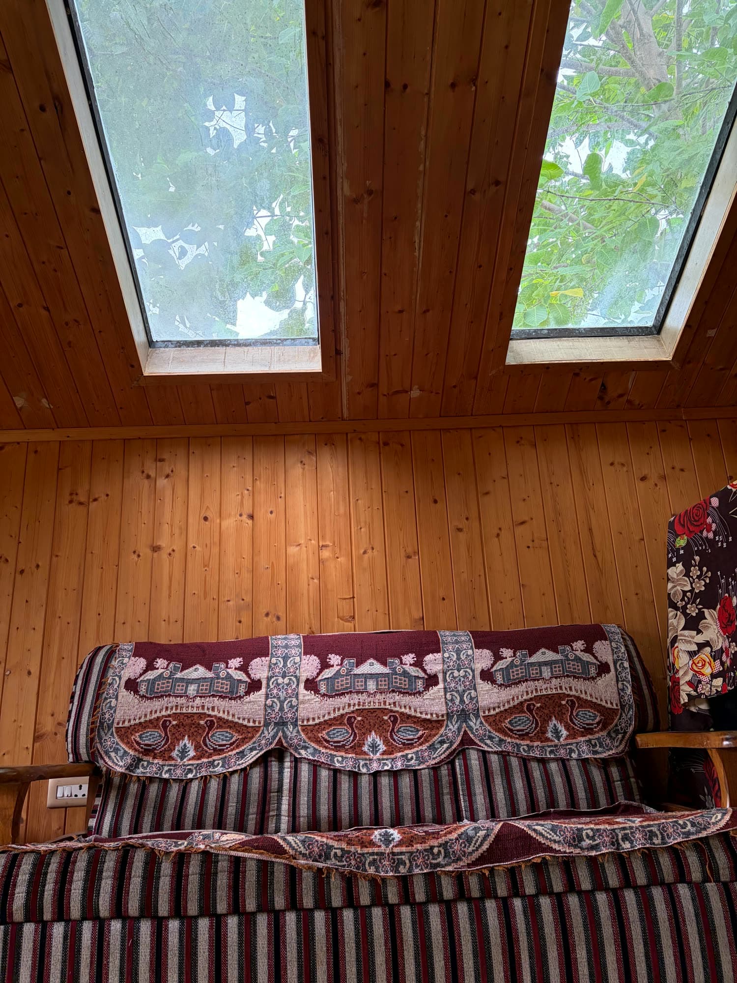 Sofa under the skylights in the timber living room
